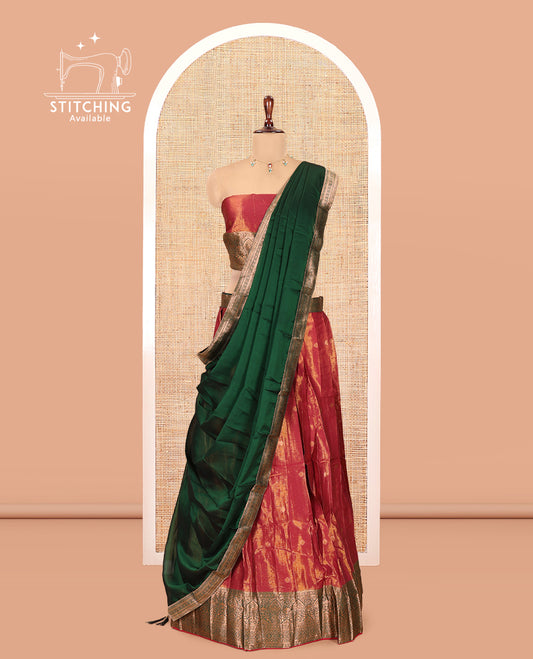 Rust-Green Shimmer Tissue Half-Saree Features Buttas Skirt, a Contrast Traditional Border, a Matching Blouse, a Contrast Dhavani
