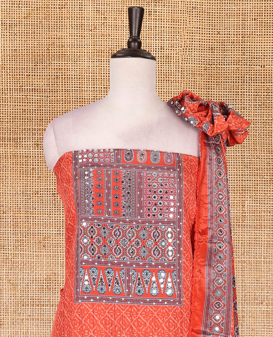 Neon orange material chudidar set, intricately printed with neck mirror work crepe top, Italian crepe bottom, and digital printed mirror work chinon dupatta