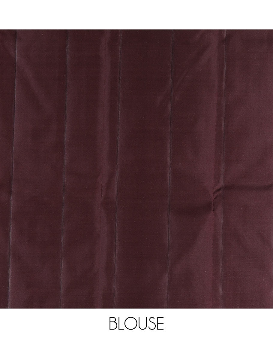 Coffee Brown Vasundhara Silk Saree Decked Up with Thazampoo Rekku Buttas and Vel Buttas, Highlighted with a Zari Border of Manga, Muthu, Kathir, Neli, and Vanki Designs, Subtly Sparkled Pallu of Jaal Design, and Paired with a Matching Blouse
