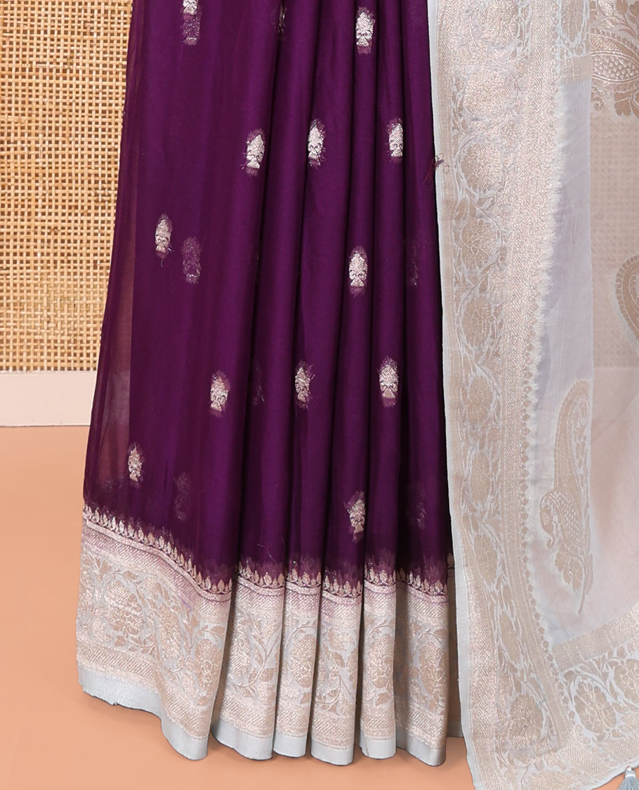 Purple Banaras Fancy Georgette Saree, Adorned with Zari Buttas All Over Its Body, Complemented by a Contrast Floral Creeper Zari Border, Pallu Features Paisley Designs, and Paired with a Contrast Blouse