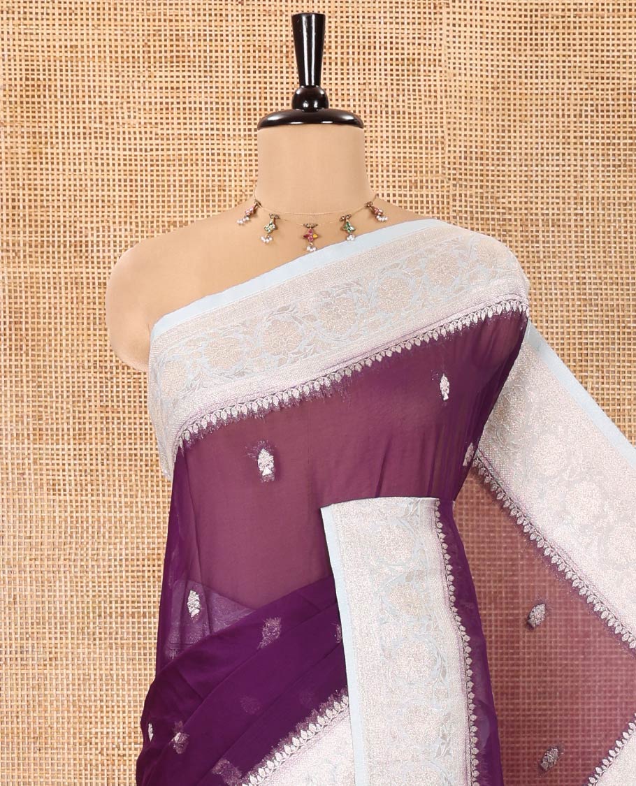 Purple Banaras Fancy Georgette Saree, Adorned with Zari Buttas All Over Its Body, Complemented by a Contrast Floral Creeper Zari Border, Pallu Features Paisley Designs, and Paired with a Contrast Blouse