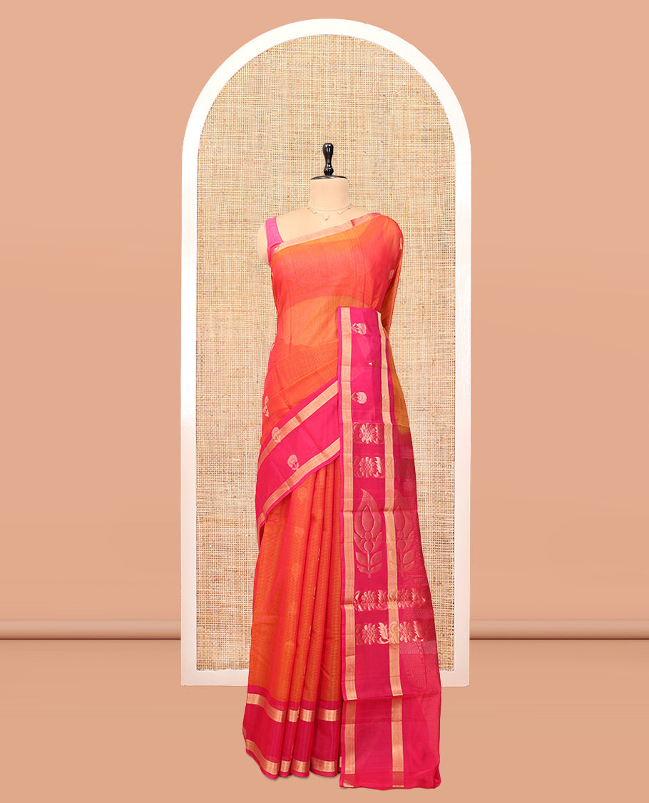 Orange Silk Cotton Saree, Gleamed Up with Zari Buttas, a Contrast Floral Creeper Border, Floral Pallu, and a Contrast Blouse