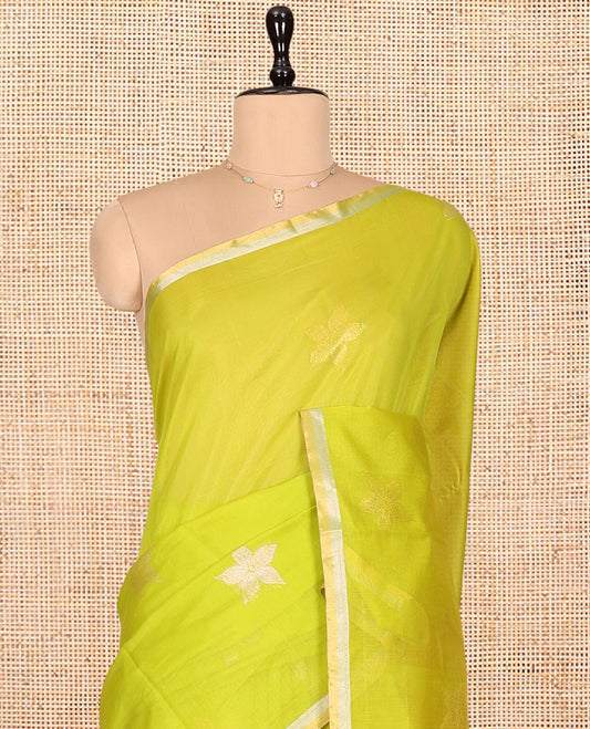 Leaf Green Silk Cotton Saree, Gleamed Up with Floral Buttas, a Subtle Piping Border, Contrast Pallu of Intricate Designs, and a Contrast Blouse