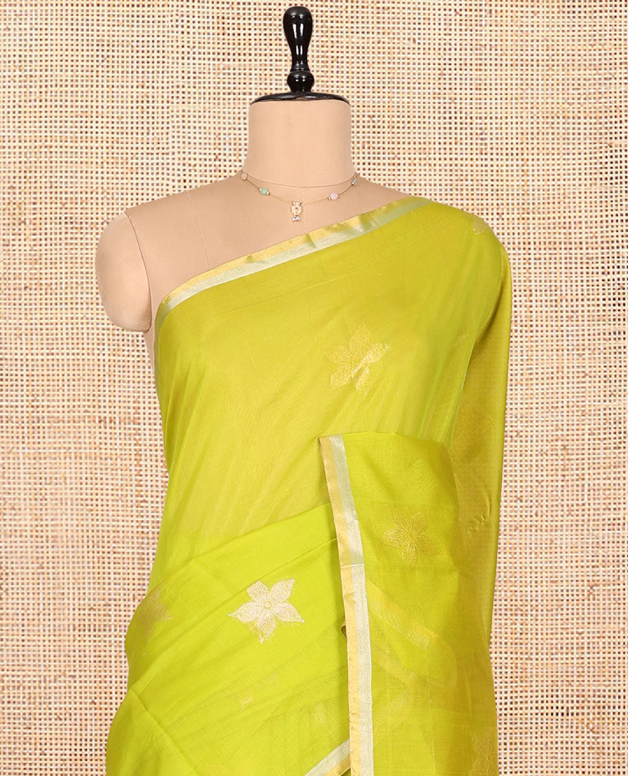 Leaf Green Silk Cotton Saree, Gleamed Up with Floral Buttas, a Subtle Piping Border, Contrast Pallu of Intricate Designs, and a Contrast Blouse