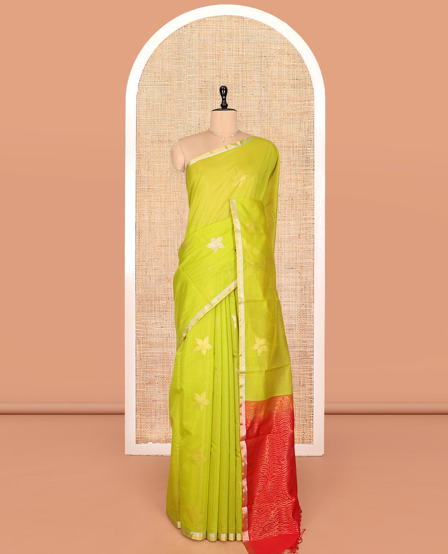 Leaf Green Silk Cotton Saree, Gleamed Up with Floral Buttas, a Subtle Piping Border, Contrast Pallu of Intricate Designs, and a Contrast Blouse
