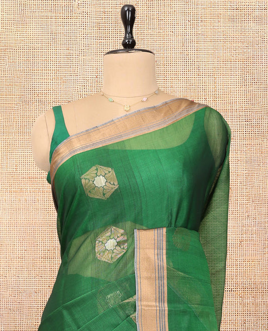 Green Cotton Saree, Highlighted by Zari Buttas, a Contrast Zari Border, an Intricate Pallu and a Contrast Blouse