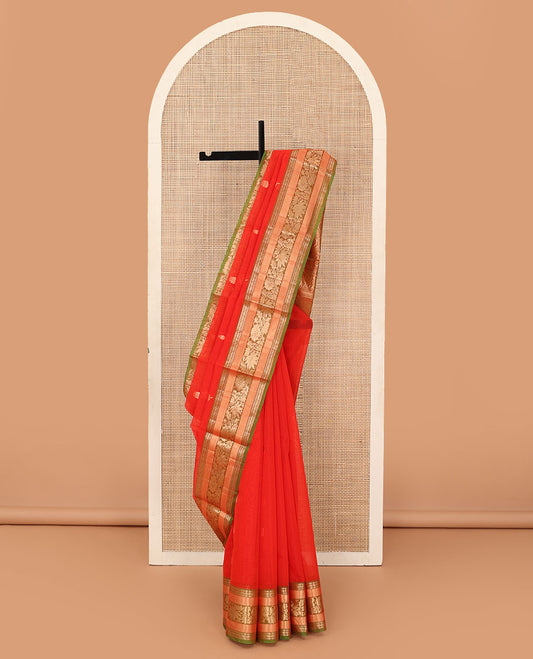 Orange zari buttas silk cotton saree, contrast traditional zari border of floral creeper design, and ogee patterned pallu
