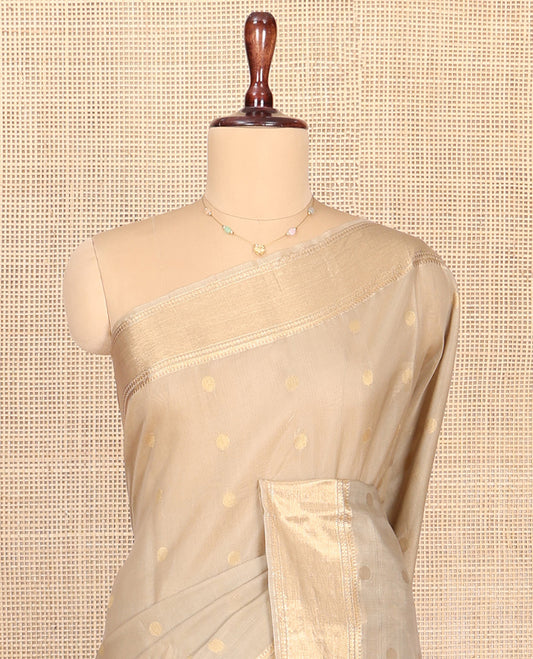 Beige Silk Cotton Saree, Gleamed up with Zari Buttas All Over Its Body, Highlighted by Traditional Zari Designs Woven Border, Diagonally Woven Pallu and Paired with a Contrast Blouse