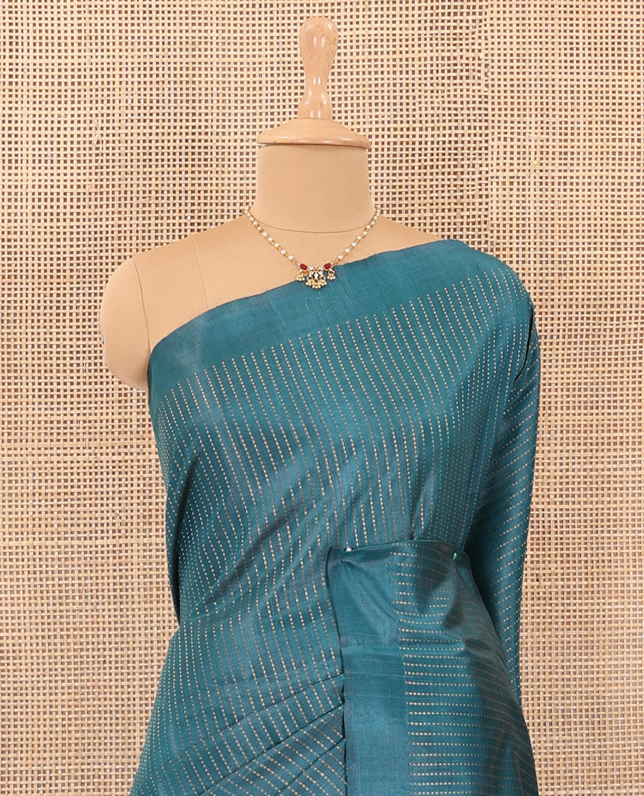Blue tiny boxed motif stripes tussar silk saree, self-border, and gleaming zari pallu