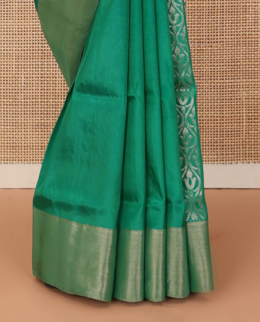 Green zari buttas Uppada saree, bavanji border, and contrast intricately designed pallu