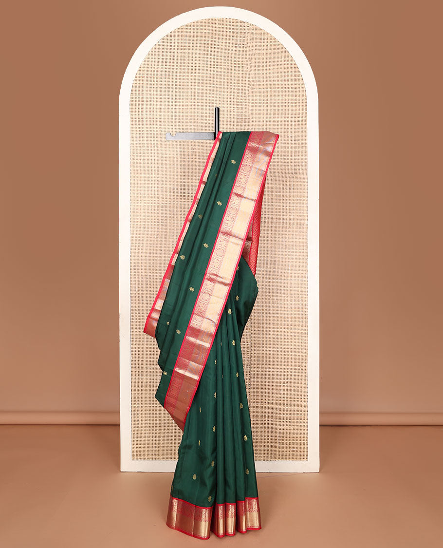 Green vasundhara elite silk saree with iruthalaipakshi buttas, contrast border of temple, poun, iruthalaipakshi, muthu & kamalam designs & manga butta enclosed checks