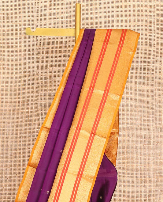 Purple Vasundhara Lite-Silk Mix Saree Decked Up with Zari Buttas on Its Body, Complemented by a Contrast Border of Neli, Muthu, and Kodi Visiry Designs, Pallu Spotlighted with Jaal Designs, and Paired with a Contrast Blouse