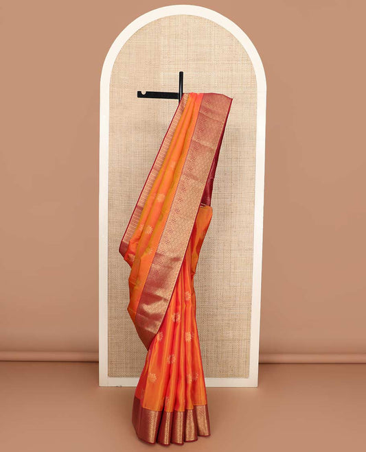 Orange zari buttas Vasundhara silk mix saree, contrast border of thilakam, muthu, manga, kodi visiry, and jaal and Mughal-style paisley woven pallu