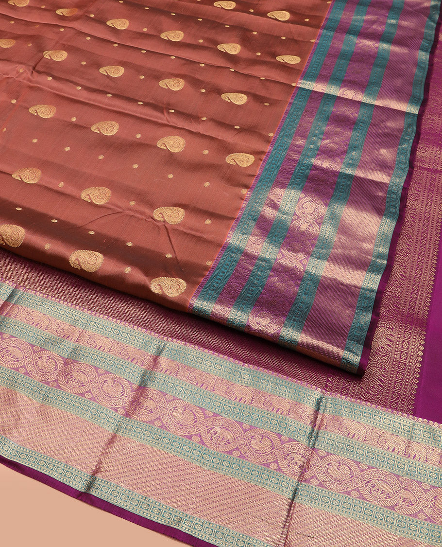 Brown Vasundhara Lite Silk Mix Saree, Elegantly Highlighted with Manga Buttas All Over Its Body, Complemented by Contrast Border of Thilakam Mokku, Kamalam, Yaanai, and Mayil Designs, Grandly Pallu of Diagonal Stripes, and Paired with a Contrast Blouse