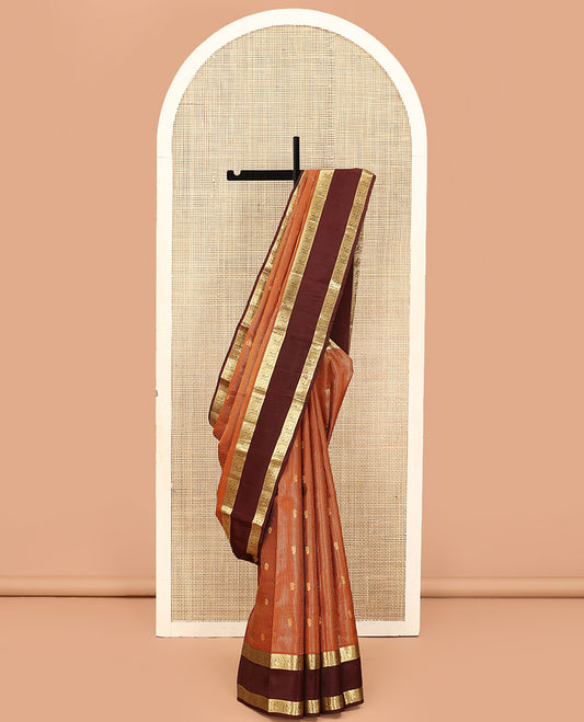 Orange Vasundhara Lite Silk Mix Saree, Embellished with Zari Butta Enclosed Checks on Its Body, Complemented by a Contrast Rettai Pettu Border of Mayil Designs, Pallu Steeped with Peaock Feather-Like Designs, and Paired with a Contrast Blouse