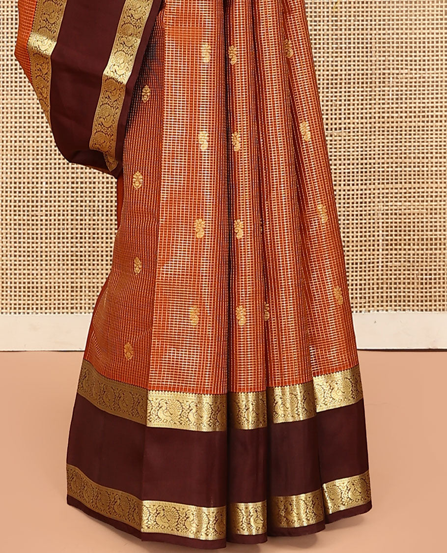 Orange Vasundhara Lite Silk Mix Saree, Embellished with Zari Butta Enclosed Checks on Its Body, Complemented by a Contrast Rettai Pettu Border of Mayil Designs, Pallu Steeped with Peaock Feather-Like Designs, and Paired with a Contrast Blouse
