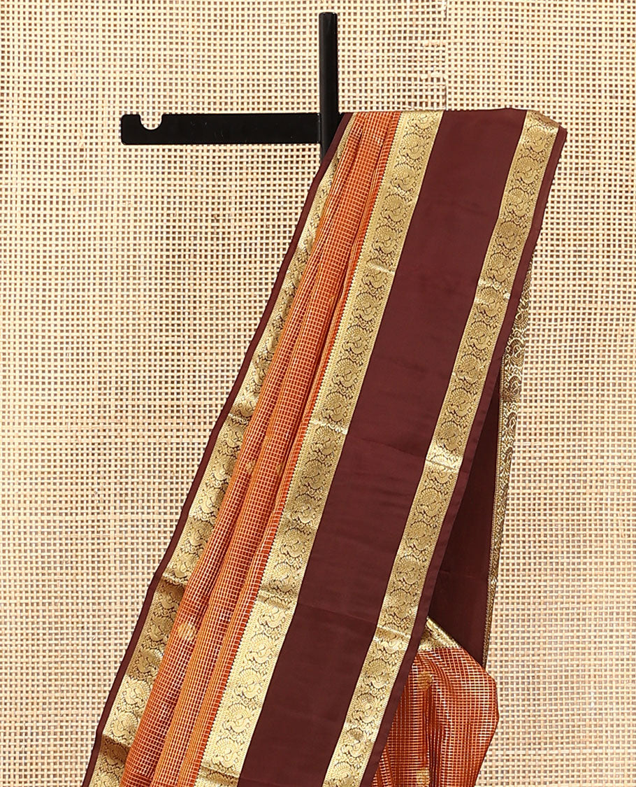 Orange Vasundhara Lite Silk Mix Saree, Embellished with Zari Butta Enclosed Checks on Its Body, Complemented by a Contrast Rettai Pettu Border of Mayil Designs, Pallu Steeped with Peaock Feather-Like Designs, and Paired with a Contrast Blouse