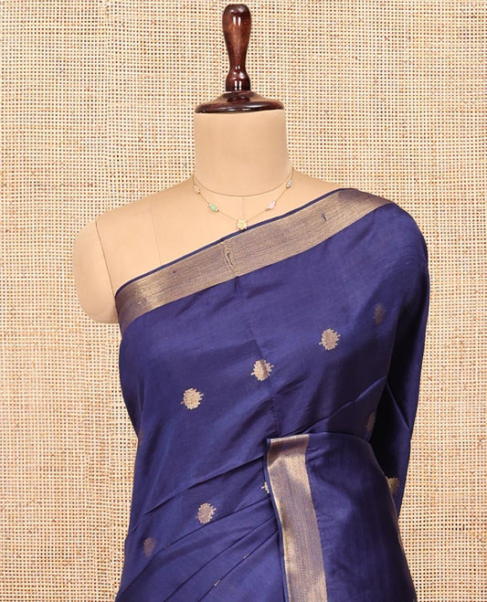 Blue Banana Pith Saree, Subtly Adorned with Buttas All Over Its Body, Highlighted by a Zari Bavanji Border, Gleaming Zari Striped Pallu, and Paired with a Matching Blouse