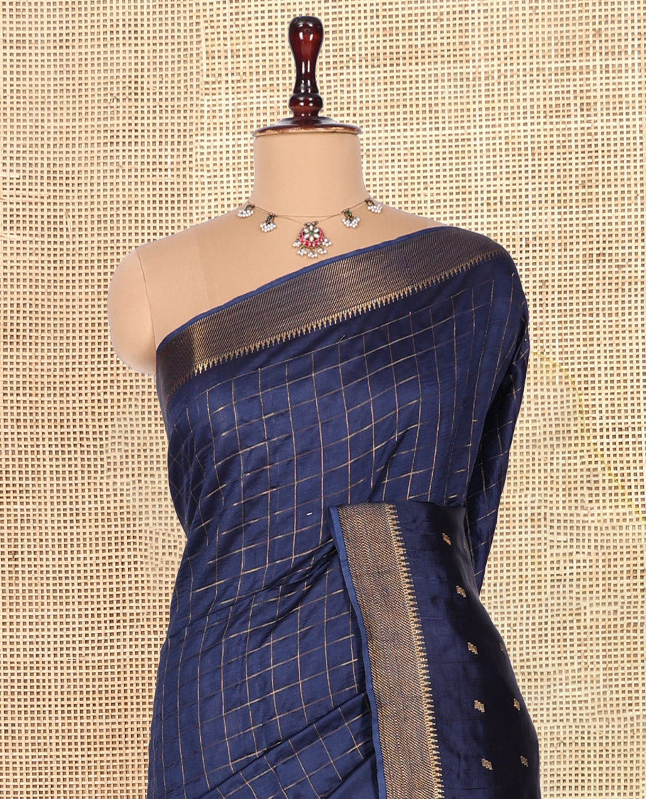 Blue Banana Pith Saree, Gleamed Up with Checks and Buttas, a Zari Temple Border, Striped Pallu, and Matching Blouse