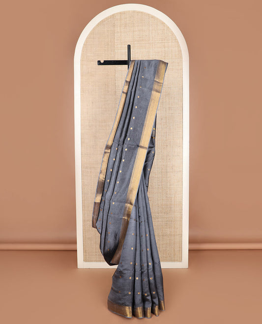 Grey buttas banana pith saree, zari temple border, and zari striped pallu