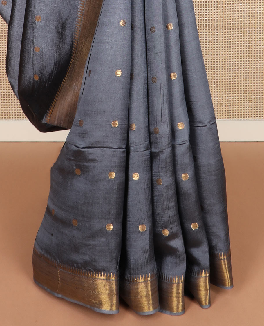 Grey buttas banana pith saree, zari temple border, and zari striped pallu