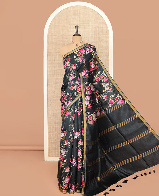 Black Banana Pith Saree Colorful Sparkled with Floral Motifs Print, Subtle Zari Border, Gleaming Zari Striped Pallu, and Paired with a Contrast Floral Printed Blouse
