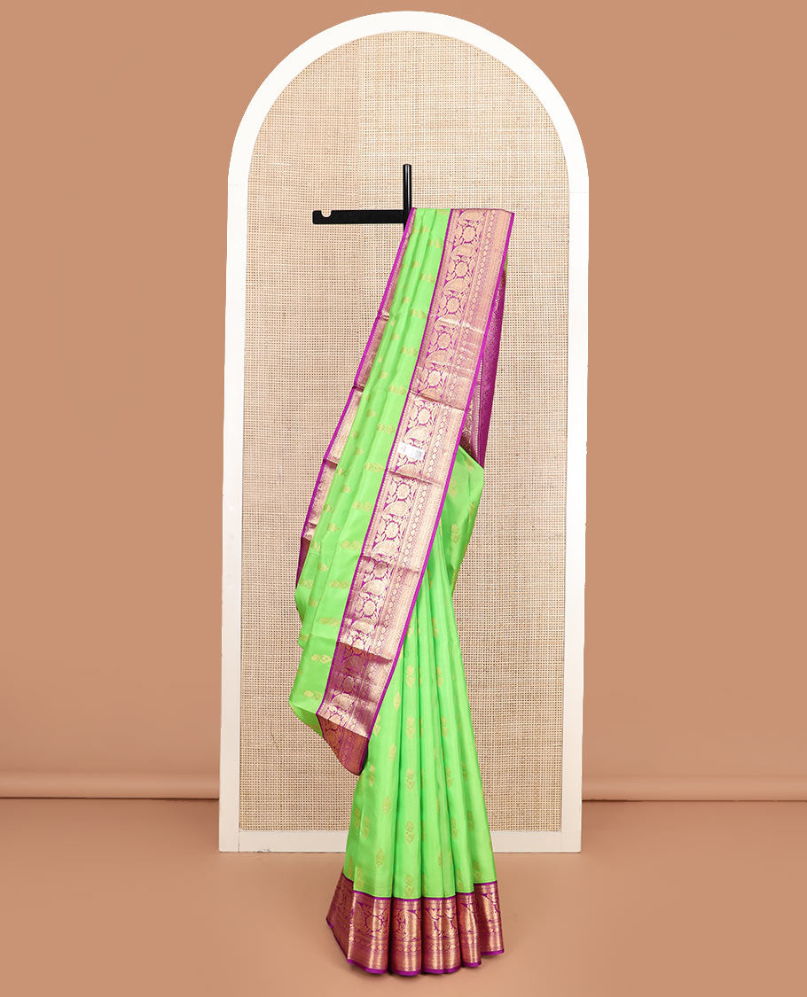 Parrot green zari buttas silk saree, contrast border of thilakam mokku, kathir, floral, manga, thilakam, neli, and diamond designs, and jaal pallu