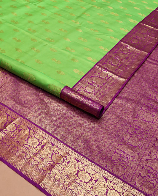 Parrot green zari buttas silk saree, contrast border of thilakam mokku, kathir, floral, manga, thilakam, neli, and diamond designs, and jaal pallu