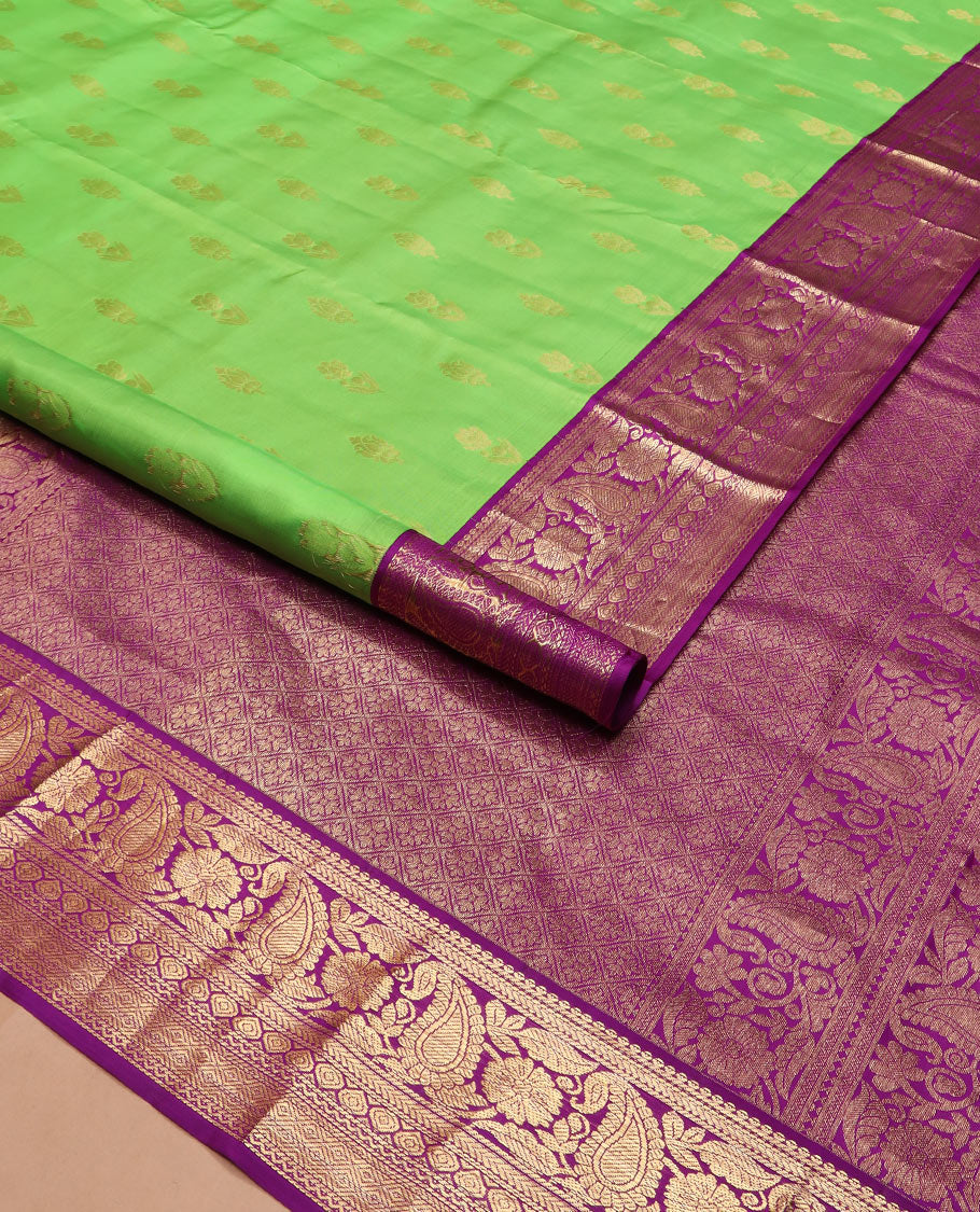Parrot green zari buttas silk saree, contrast border of thilakam mokku, kathir, floral, manga, thilakam, neli, and diamond designs, and jaal pallu
