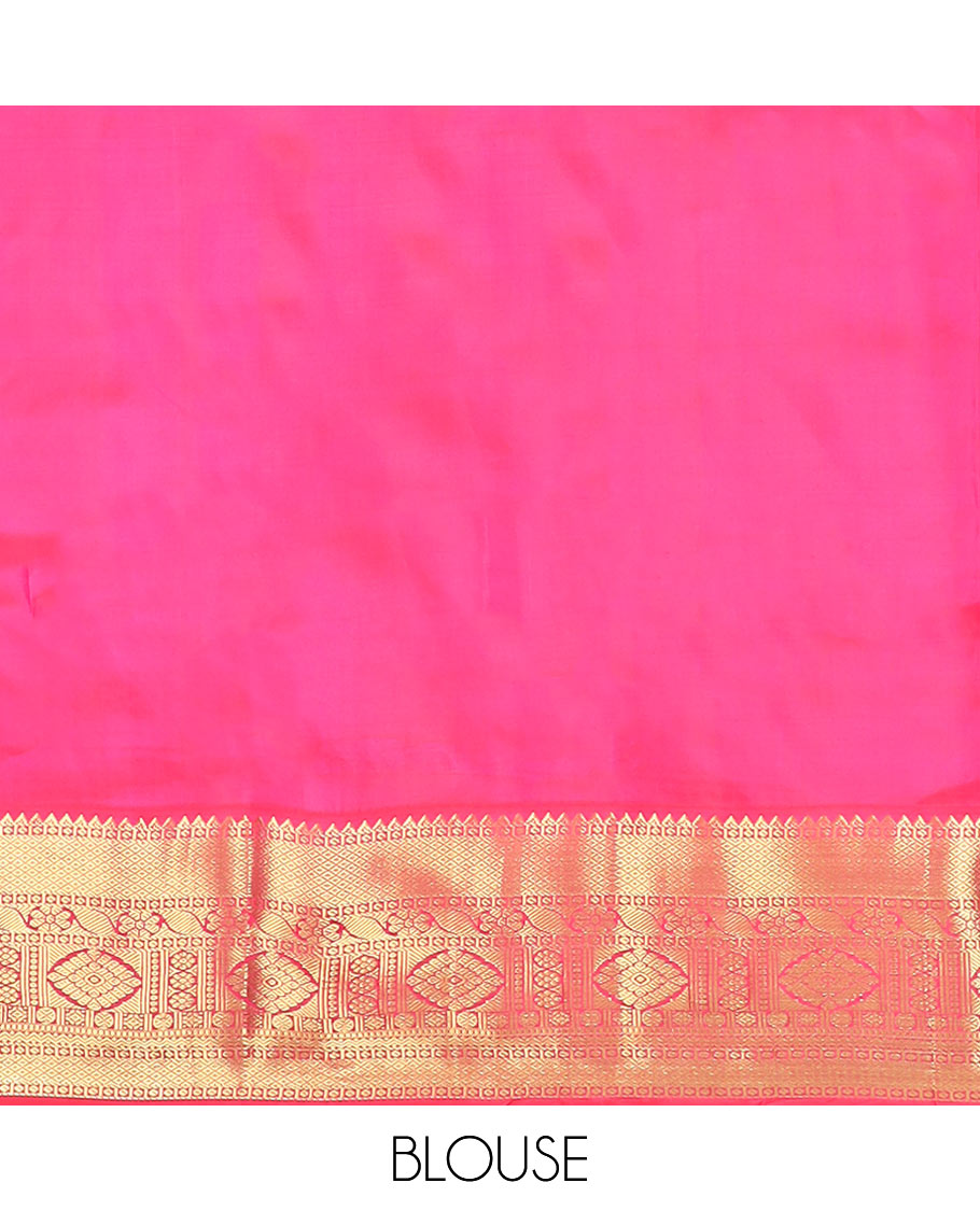 Green Vasundhara Silk Saree Decorated with Zari Buttas, Complemented by a Contrast Border of Rekku, Mayil Kann, Cross Kamalam, Laddu Kamalam, Rudraksham, Rettai Neli, Muthu, and Mayil Kann, Grandly Woven Jaal Pallu, and Paired with a Contrast Blouse