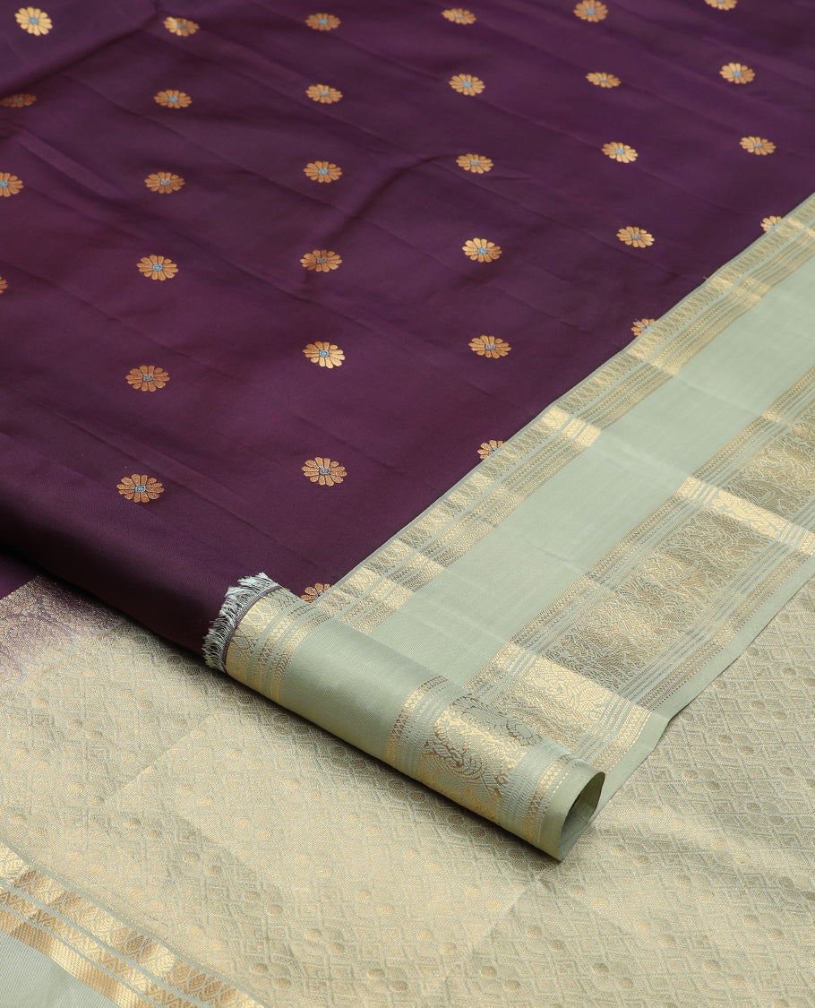 Purple meenakari kamalam buttas silk saree, contrast rettai pettu border of thilakam, neli, kathir, mayil, and yanaai designs, and intricate pallu