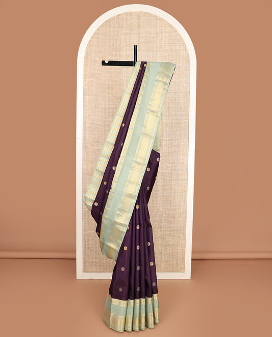 Purple meenakari kamalam buttas silk saree, contrast rettai pettu border of thilakam, neli, kathir, mayil, and yanaai designs, and intricate pallu