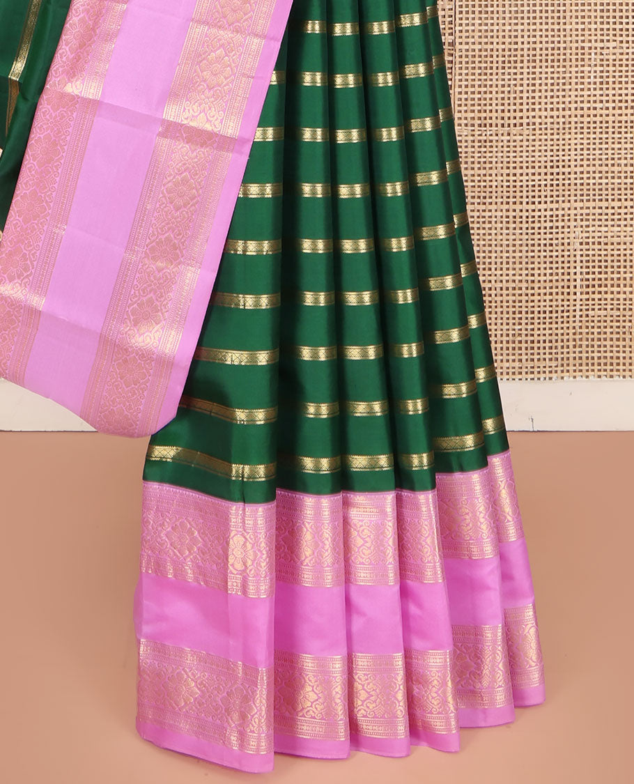 Green Vasundhara Silk Saree, Gracefully Embellished with Zari Stripes All Over Its Body, Complemented by Contrast Rettai Pettu Traditional Zari Design Border, Intricately Designed Pallu, and Paired with a Contrast Blouse