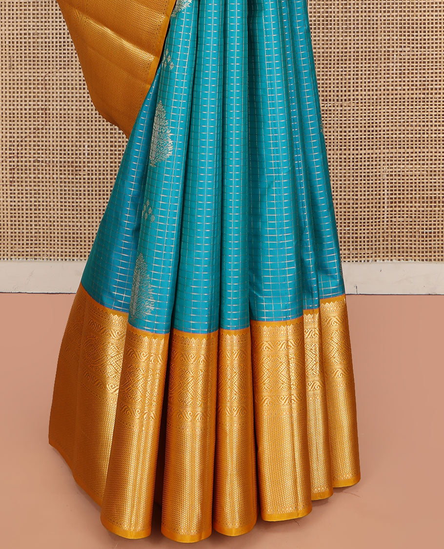 Blue Vasundhara Silk Saree, Masterfully Woven with Zari Buttas and Zari Checks All Over Its Body, Complemented by a Contrast Border of Traditional Designs, Grandly Woven Jaal Pallu, and Paired with a Contrast Blouse