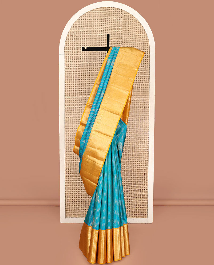 Blue Vasundhara Silk Saree, Masterfully Woven with Zari Buttas and Zari Checks All Over Its Body, Complemented by a Contrast Border of Traditional Designs, Grandly Woven Jaal Pallu, and Paired with a Contrast Blouse