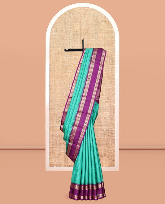 Turquoise Checked Vasundhara Silk Saree, Contrast Rettai Pettu Border of Rekku, Salngai, Kathir, Banaras, Star Vanki, and Kamalam, Pallu of Iruthalai Pakshi, and Yaali, and a Contrast Blouse