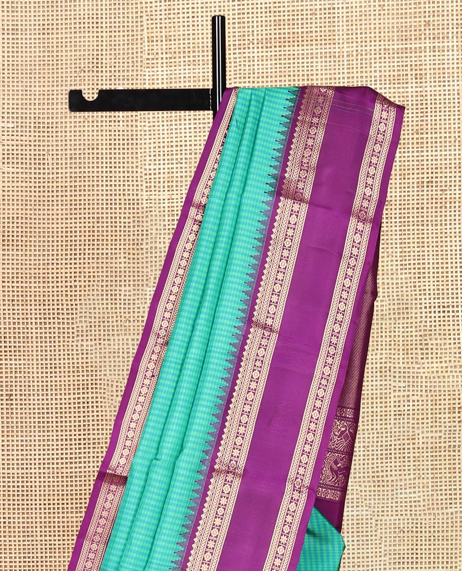 Turquoise Checked Vasundhara Silk Saree, Contrast Rettai Pettu Border of Rekku, Salngai, Kathir, Banaras, Star Vanki, and Kamalam, Pallu of Iruthalai Pakshi, and Yaali, and a Contrast Blouse