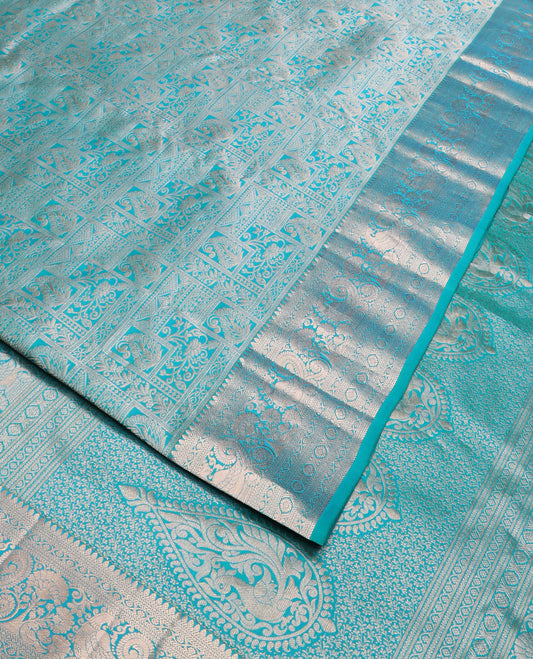 Blue jacquard Kanchipuram wedding silk saree, zari border of thilakam, kathir, kodi visiry, mayil, and laddu kamalam designs, and intricate pallu