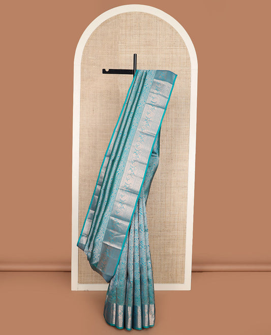 Blue jacquard Kanchipuram wedding silk saree, zari border of thilakam, kathir, kodi visiry, mayil, and laddu kamalam designs, and intricate pallu