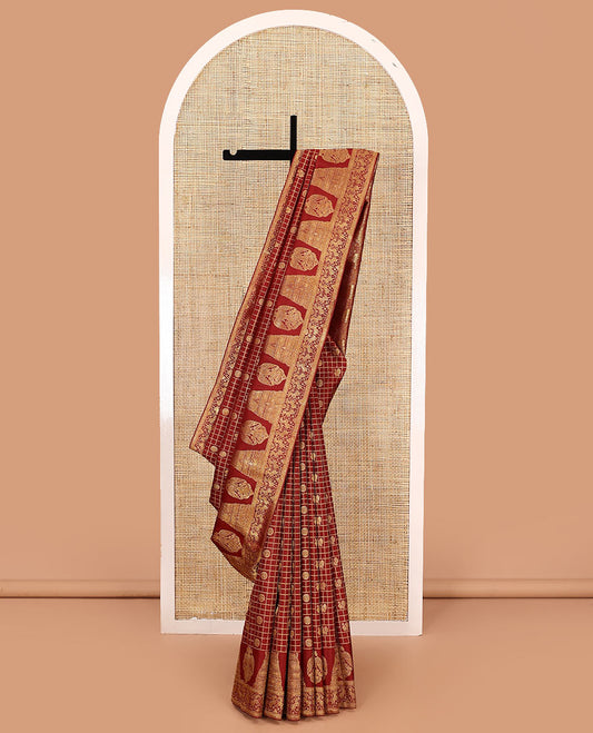 Terracotta red annam chakram with checked kanchipuram silk saree, zari border of gopuram, iruthalai pakshi, mayil kann, and yaali designs, and intricate pallu