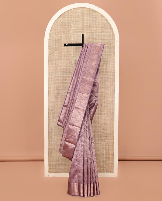 Purple Kanchipuram Wedding Silk Saree, Beautifully Bedecked with Mayil-Chakram Jacquard on Its Body, Highlighted by a Zari Border of Thilakam Mokku, Kodi Visiry, Annam, and Yaanai Designs, Intricately Designed Pallu, and Paired with a Matching Blouse