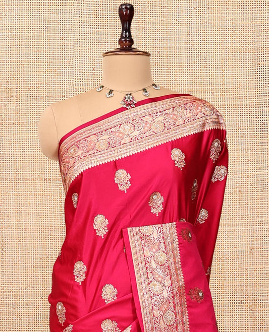 Pink Banarasi Satin Saree, Spotlighted with Floral Buttas, a Floral Creeper Border, Intricate Stonework Pallu, and a Matching Blouse