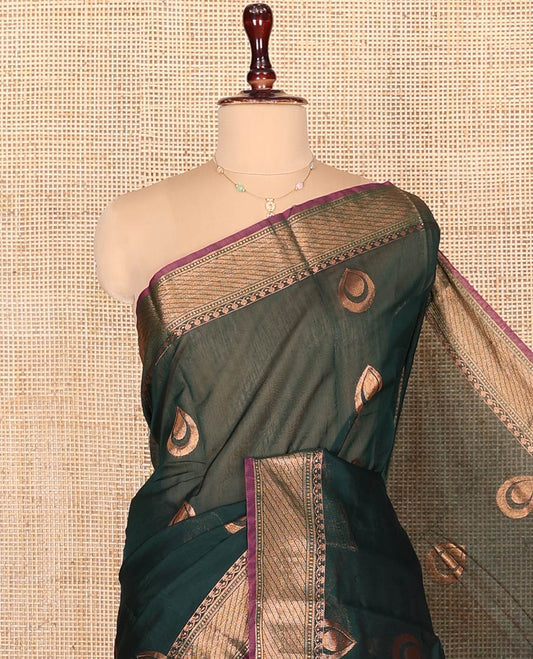 Green Semi-Silk Cotton Saree, Enthralled with Drop-Shaped Zari Buttas on Its Body, Complemented by Contrast Traditional Zari Border, Grand Pallu of Jaal Designs, and Paired with a Contrast Blouse