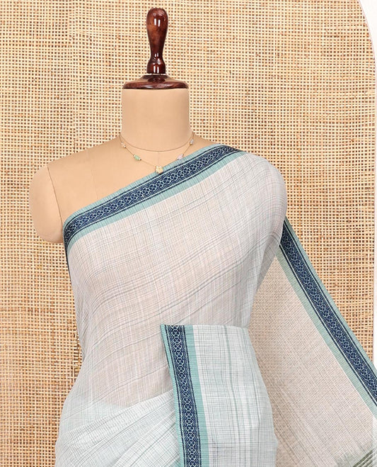 Pale Blue Andhra Cotton Saree, Sparsely Textured Heathered Patterns All Over Its Body, Complemented by Contrast Traditional Border, Pallu Steeped with Stripes, and Paired with a Matching Blouse
