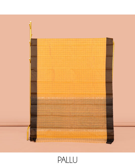 Yellow Semi-Silk Cotton Saree, Sparsely Threaded with Checks All Over Its Body, Complemented by a Contrast Border, Striped Pallu, and Paired with a Matching Blouse