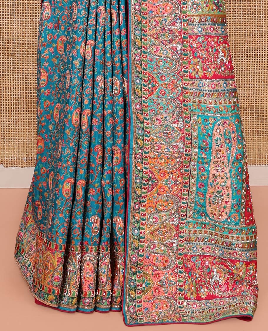Blue Dola Silk Saree, Opulently Embellished with Colorful Floral-Paisley Design on Its Body, Highlighted by Print and Embroidery Border, Colorfully Decked Up Pallu, and Paired with a Contrast Blouse