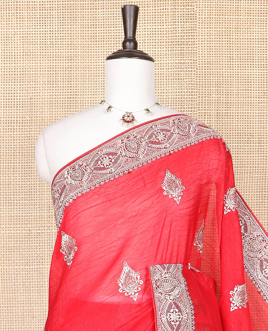 Red designer saree with unique embroidered motifs in micro-stone, intricately embroidered border