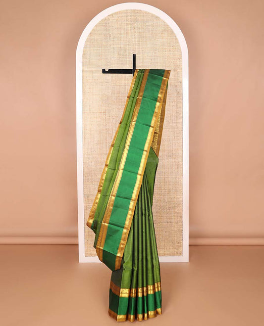 Green striped kancheepuram silk saree with contrast rettai pettu border of manga, banaras, kathir design & checked pallu