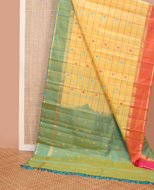 Yellow chakra butta enclosed checks kanchipuram silksaree, contrast rettai pettu ganga jamuna border of rekku,banaras,muthu & poun & chakra pallu