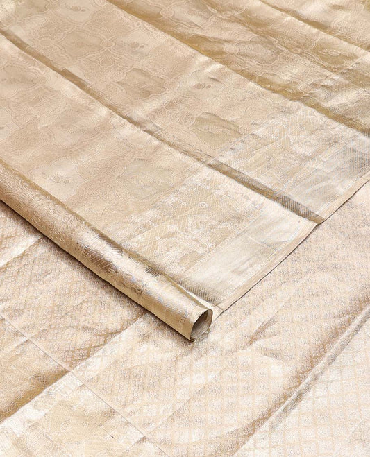 Gold jacquard Kanchipuram silk saree, wedding-theme border, and jaal pallu